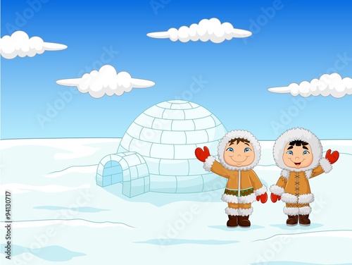 Little kids wearing traditional Eskimo costume with igloo house 