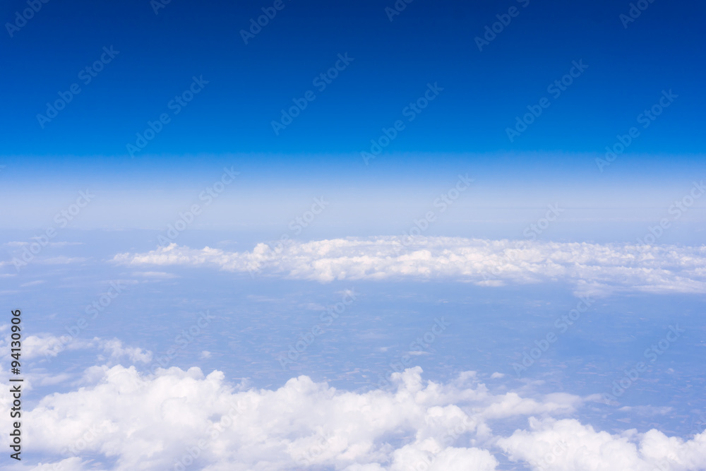 skyline view above the clouds from air plane skyline view above the clouds from air plane