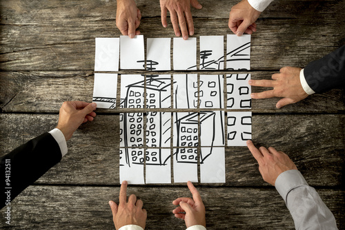 Φωτογραφία Top view of eight architects cooperating in urban development