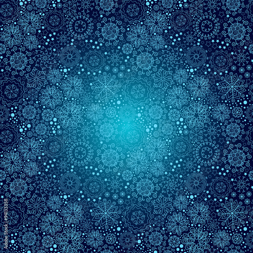 Vector Christmas seamless pattern with snowflakes on a blue background.