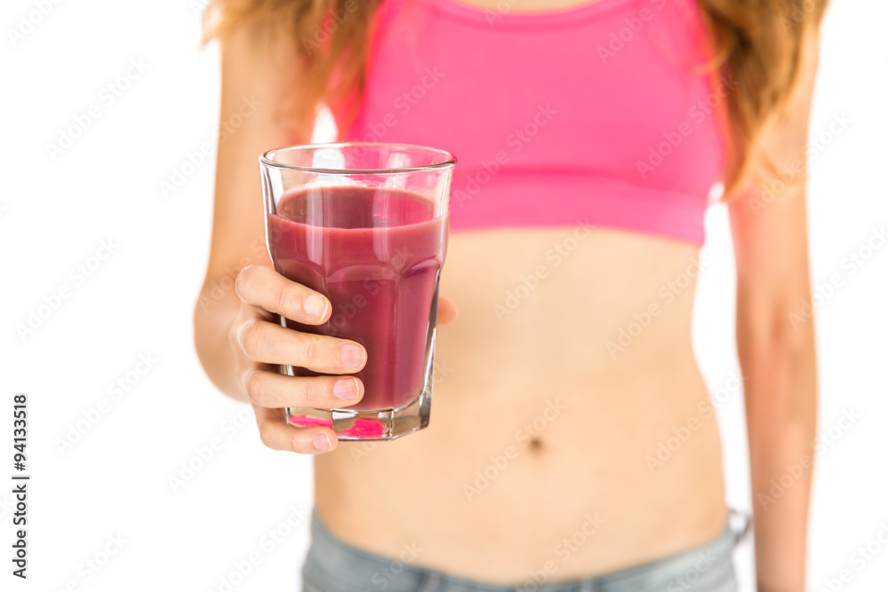 Healthy lifestyle woman showing a glass of pink smoothie Healthy lifestyle woman showing a glass of pink smoothie