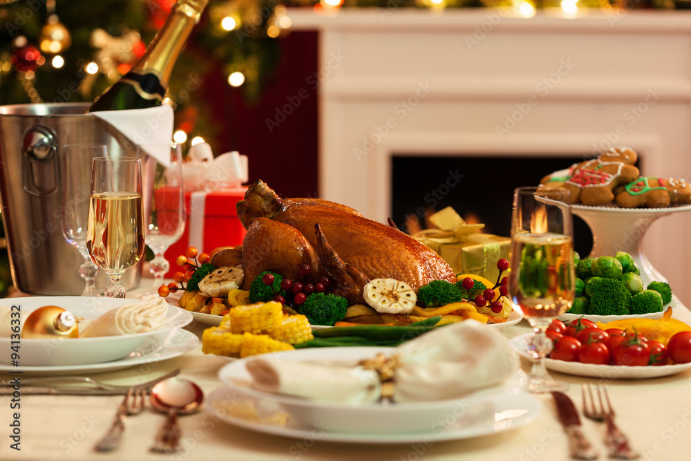 Christmas Turkey dinner served in front of a Christmas tree Christmas Turkey dinner served in front of a Christmas tree