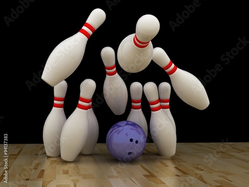 Bowling ball with pins on wooden floor
