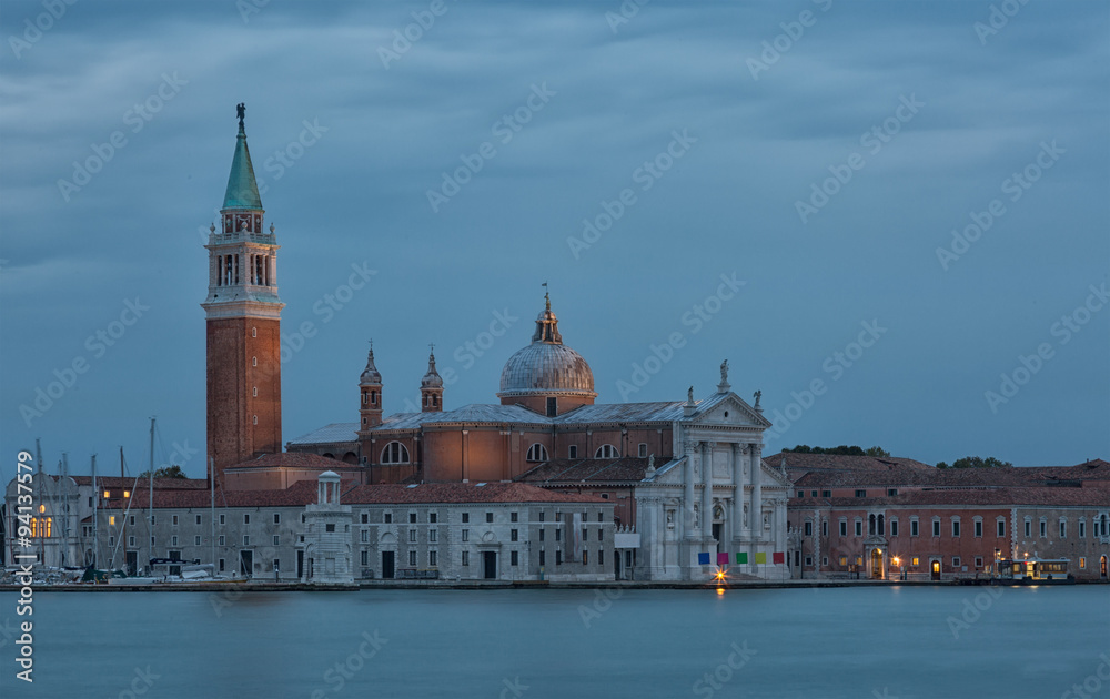 island of San Giorgio Maggiore and the church of the same name with a belltower, Venice, in evening twilight