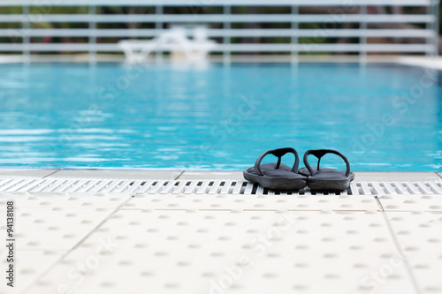 Slippers near the swimming pool