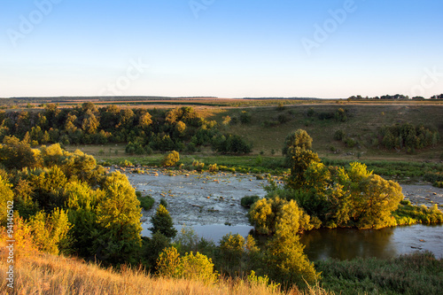 landscape of the valley, the river, trees, the field, and the sk