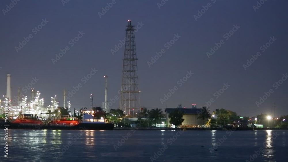 Night scene of oil and Refinery industrial factory with rivers , Bangkok city Thailand Night scene of oil and Refinery industrial factory with rivers , Bangkok city Thailand