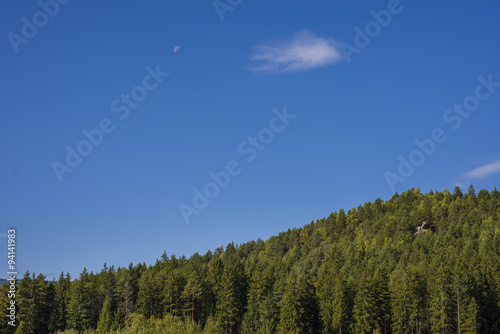 Mountain landscape in the early morning sky with clouds