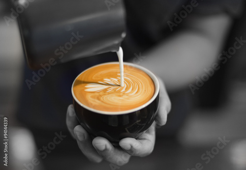 Cup of coffee latte art in coffee shop