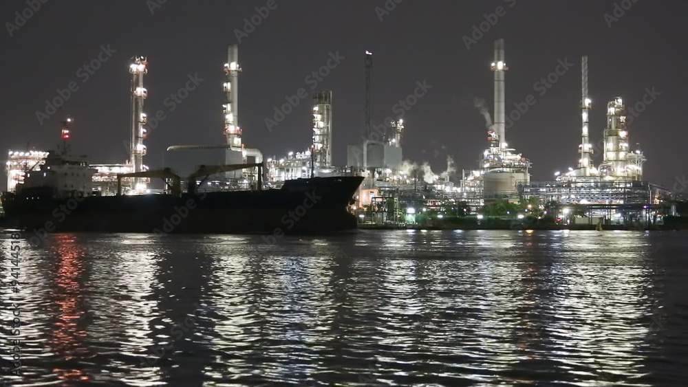 Night scene of oil and Refinery industrial factory with rivers , Bangkok city Thailand Night scene of oil and Refinery industrial factory with rivers , Bangkok city Thailand