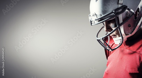Fotografie, Obraz Composite image of american footballer looking down
