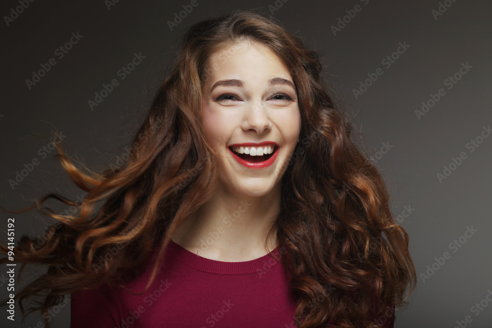Young happy woman with wind in hair Young happy woman with wind in hair