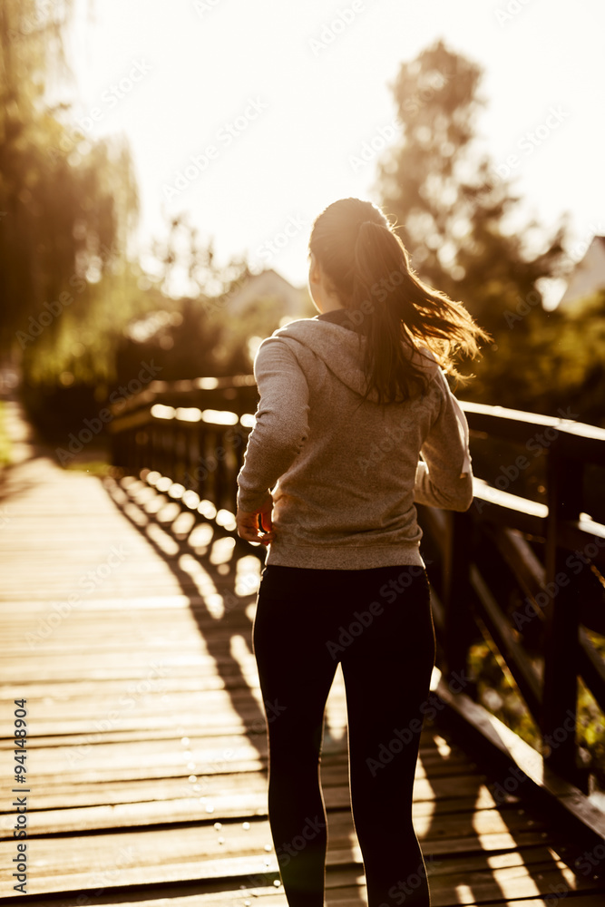 Female jogger exercising outdoors