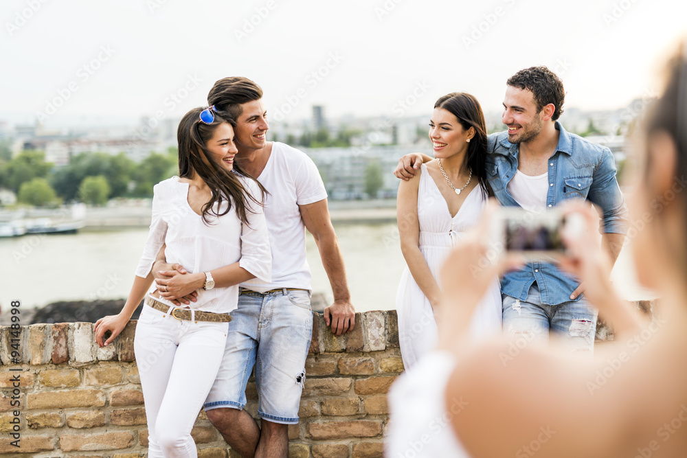 Group of young people being photographed