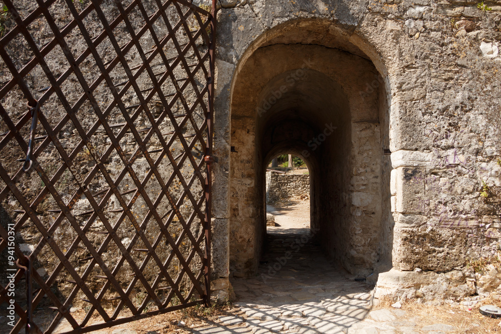Fototapeta premium Ancient stone gate with metal door
