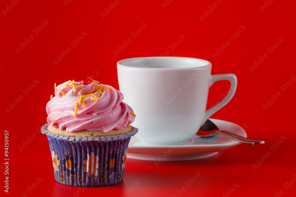 Colored cupcake on brigth red background Colored cupcake on brigth red background