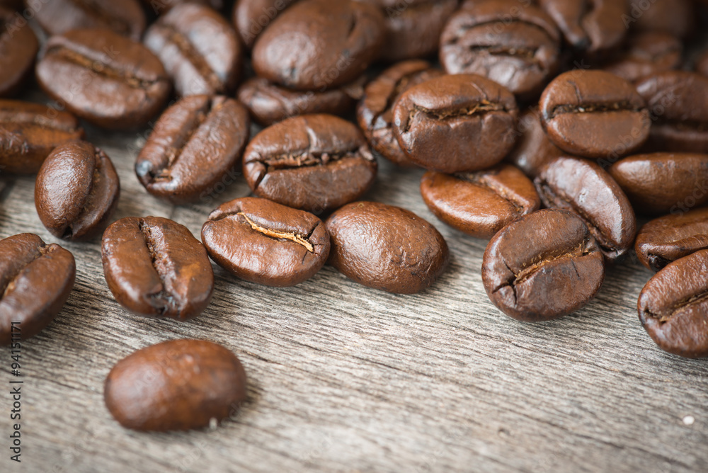 Coffee beans on the wooden top. Coffee beans on the wooden top.