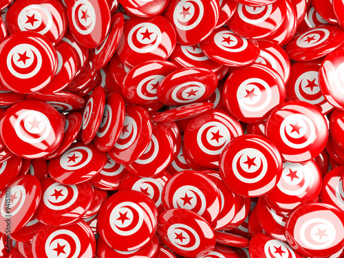 Background with round pins with flag of tunisia