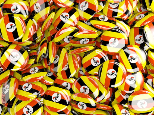 Background with round pins with flag of uganda