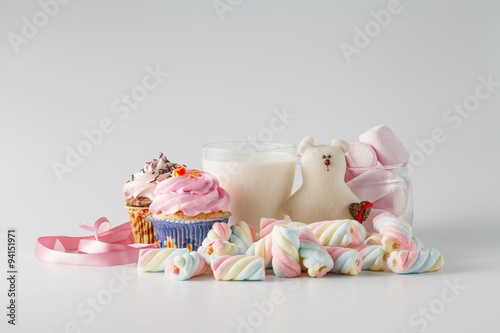 Heap of colored sweets on white background