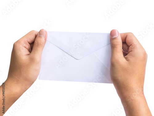 Hand holding white envelope