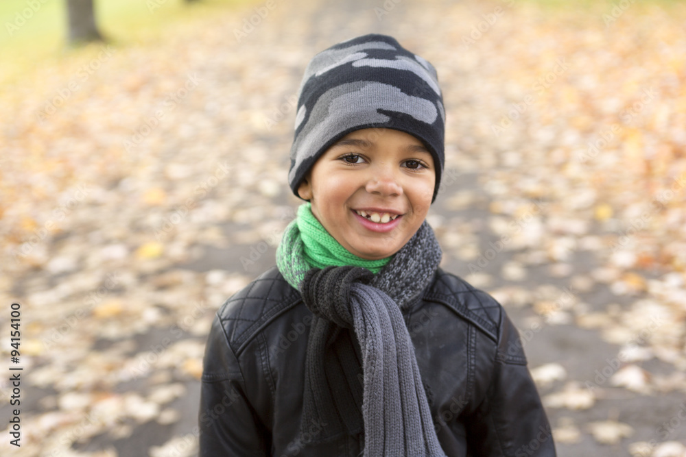 cute boy with autumn leaves in the park cute boy with autumn leaves in the park