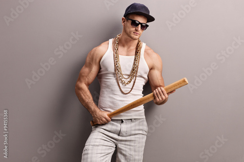 Muscular gangster holding a baseball bat