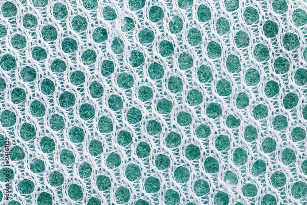Old sponge cleaning pad with nylon net texture Old sponge cleaning pad with nylon net texture