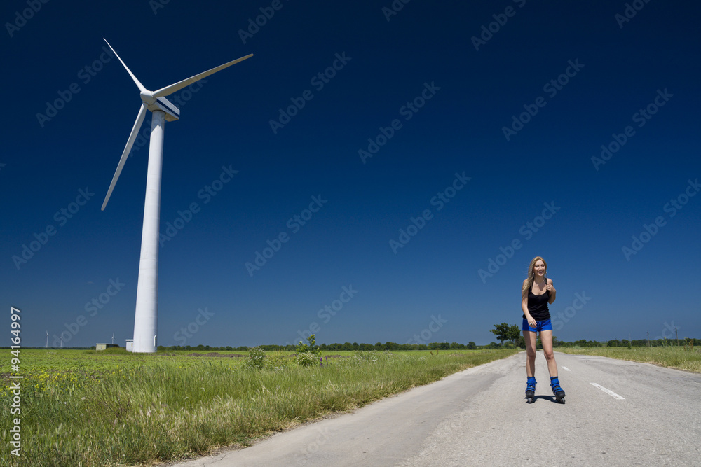 Obraz premium Female at wind power generator