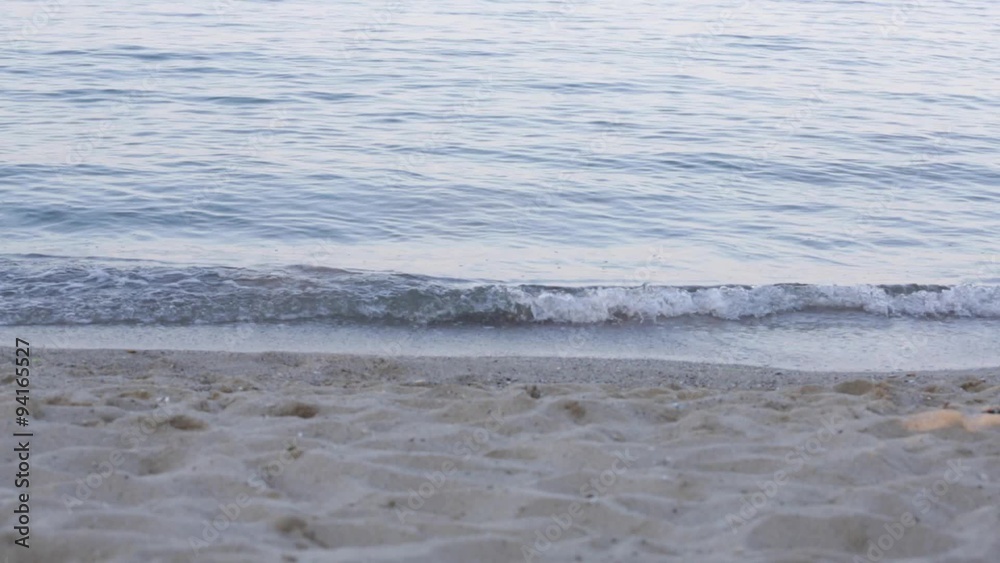 waves landing on sandy beach waves landing on sandy beach