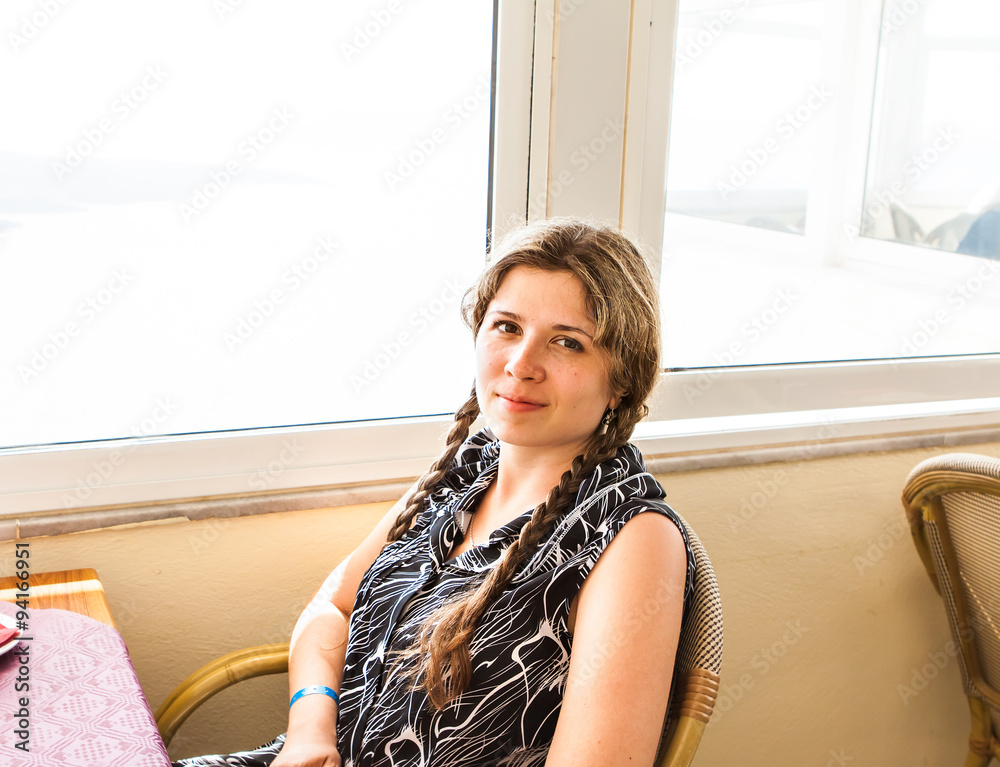 Beautiful woman sitting in a cafe Beautiful woman sitting in a cafe