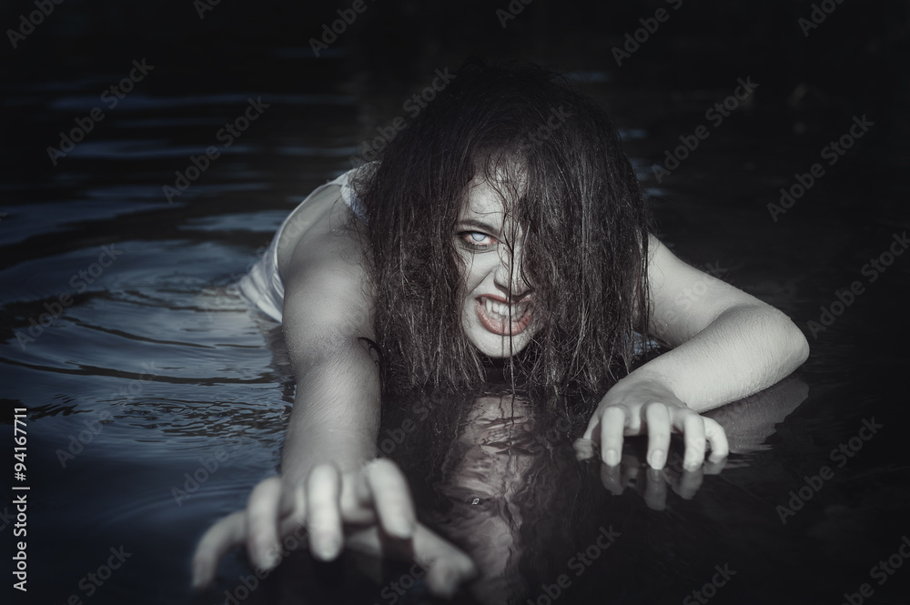Young beautiful drowned ghost woman in the water