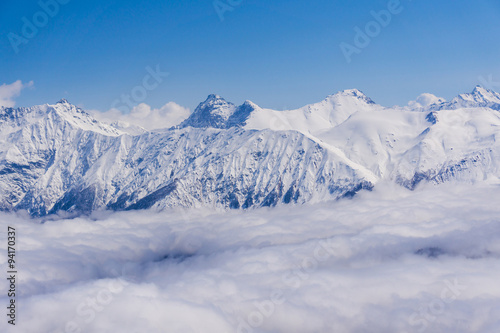 View on mountains and blue sky above clouds, Krasnaya Polyana © Vasily Merkushev