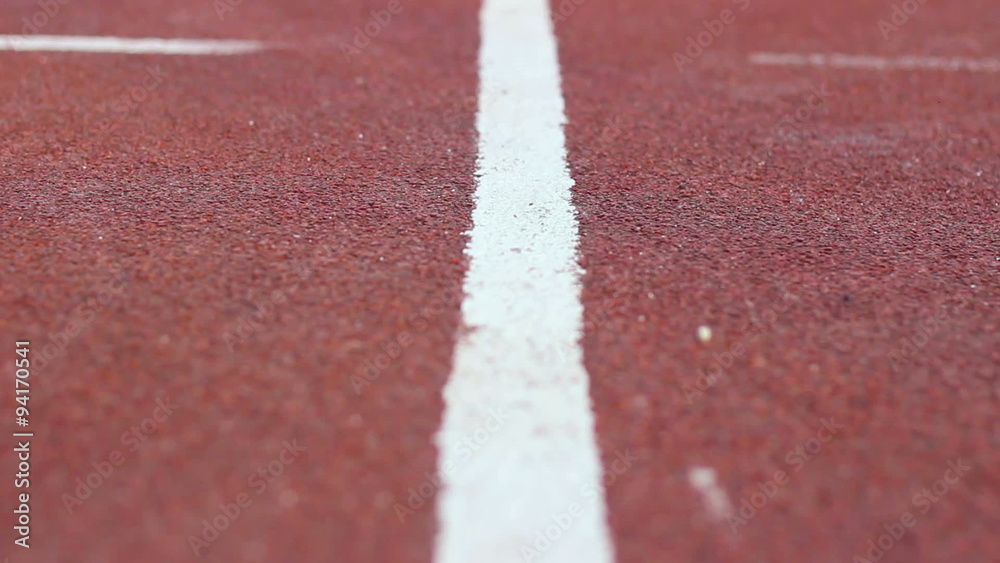 White markings on the red  starting treadmill  stadium