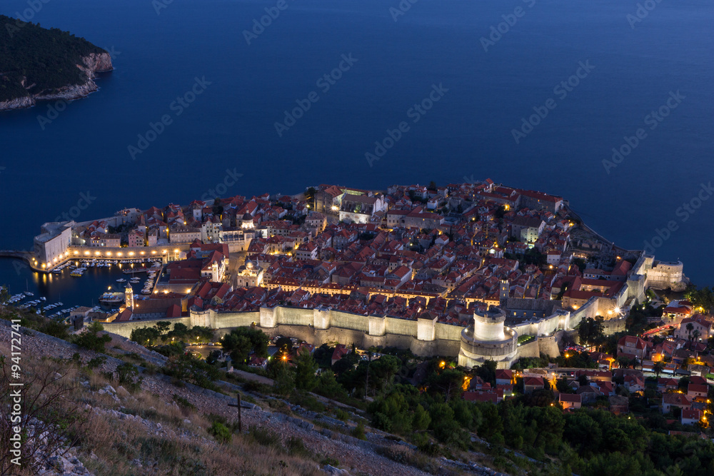 Walled Old Town of Dubrovnik in Croatia viewed from above at evening. 