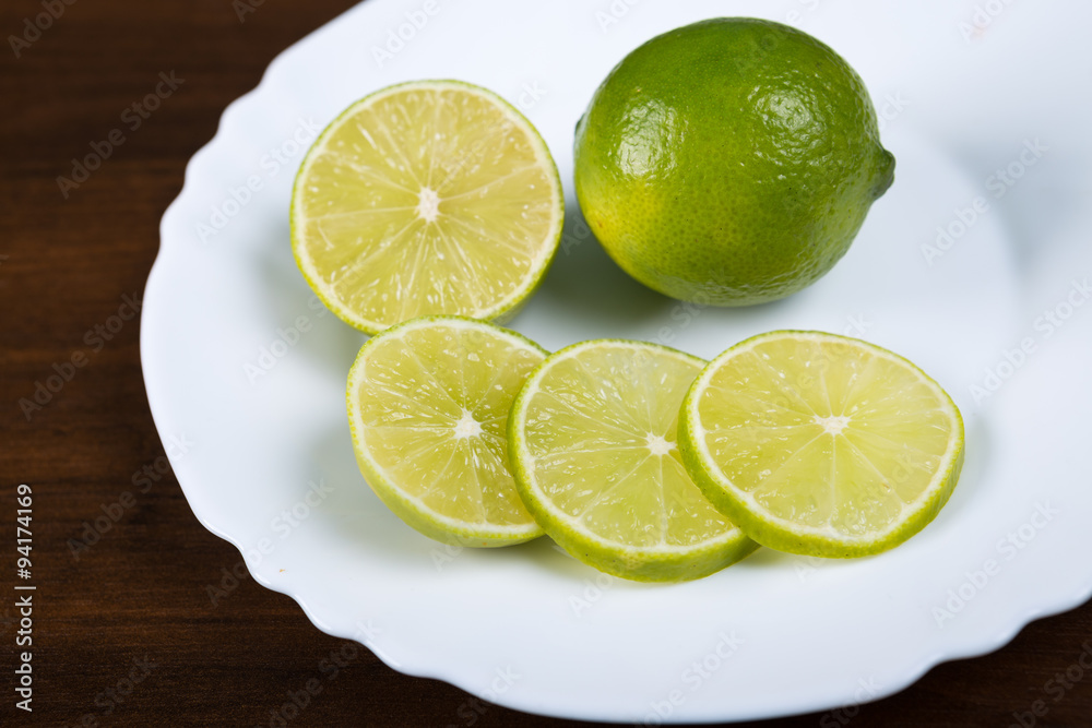 White plate with slices of lemon