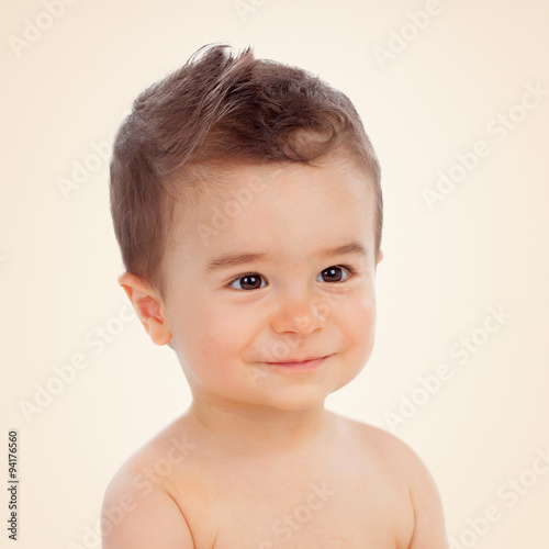 Nice baby with brown eyes smiling
