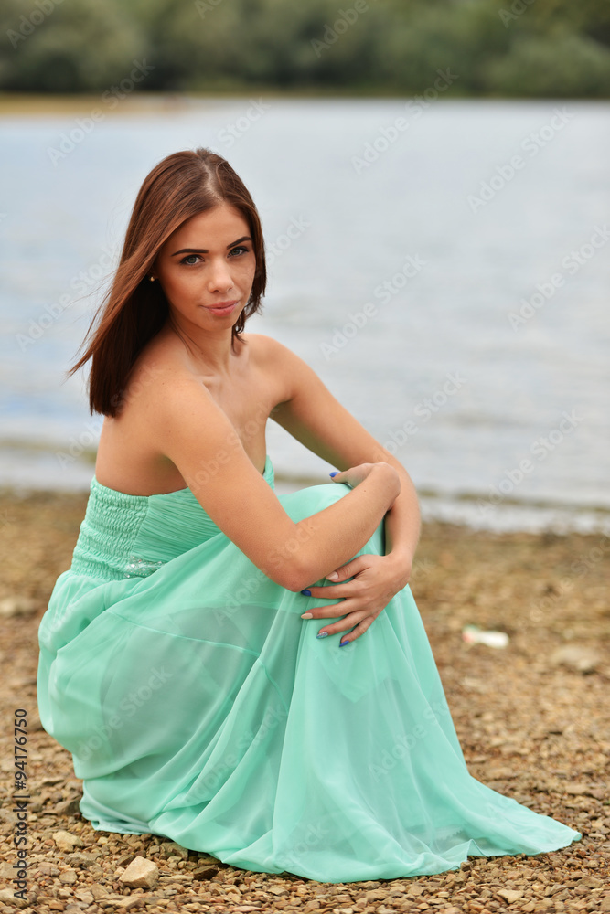 Freedom Concept. Girl standing on the beach Freedom Concept. Girl standing on the beach
