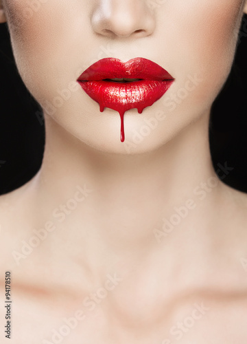 Red lips close-up, make up dripping