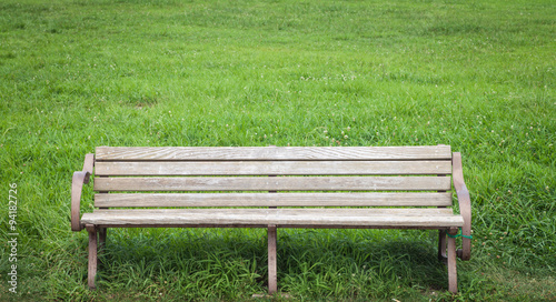 Wood bench at green park in summer season