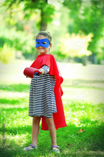 Happy little girl dressed a...