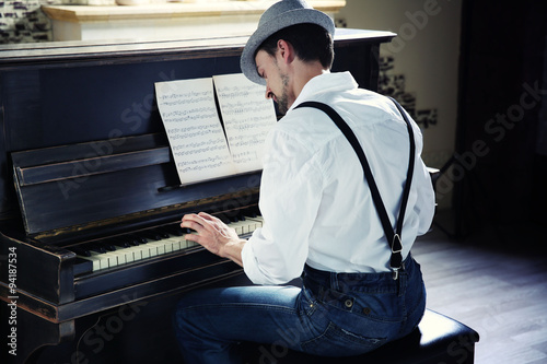 Handsome young man in hat m...