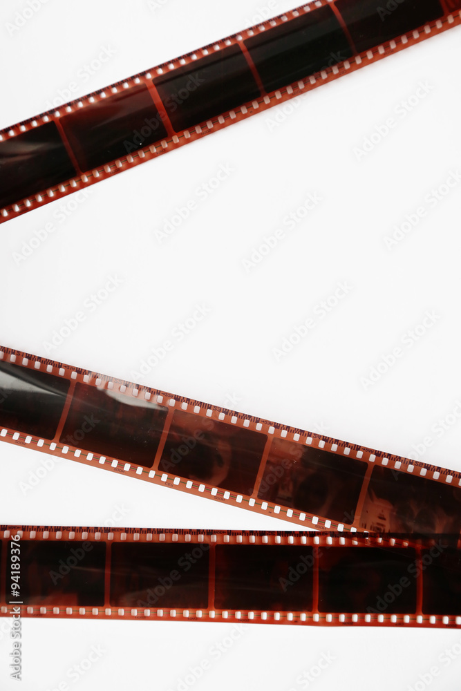 Camera film strips on white background