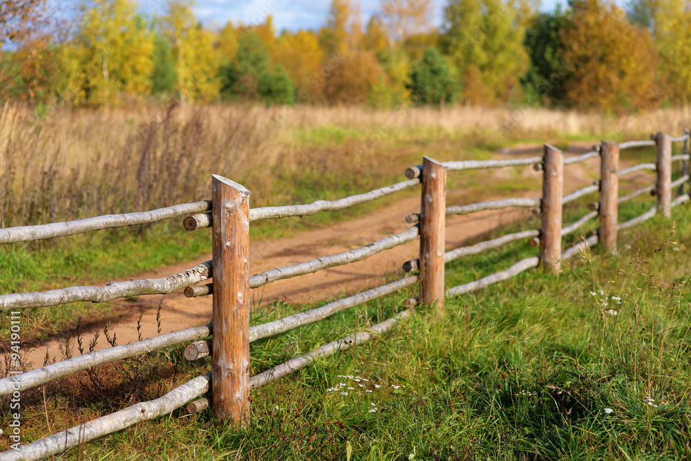 wooden fence on a sunny autumn day