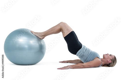  Muscular woman lying on floor with legs 