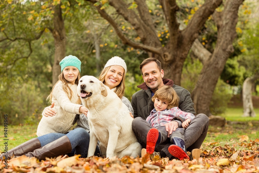 Fototapeta premium Young family with a dog