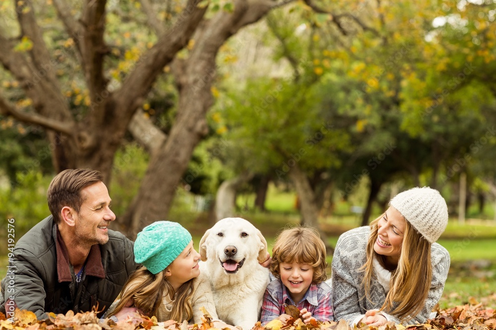Fototapeta premium Young family with a dog