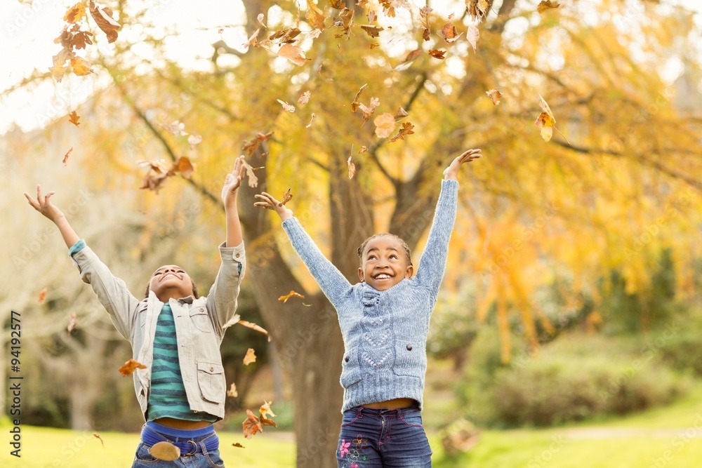 © WavebreakMediaMicro - Portrait of young children throwing leaves around © WavebreakMediaMicro - Portrait of young children throwing leaves around