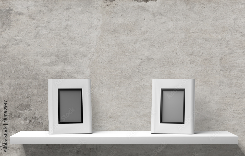 two picture frames on white board