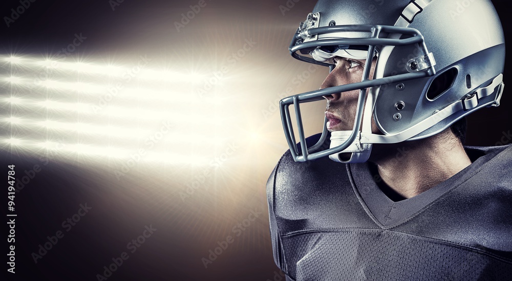 Composite image of sportsman with helmet looking away